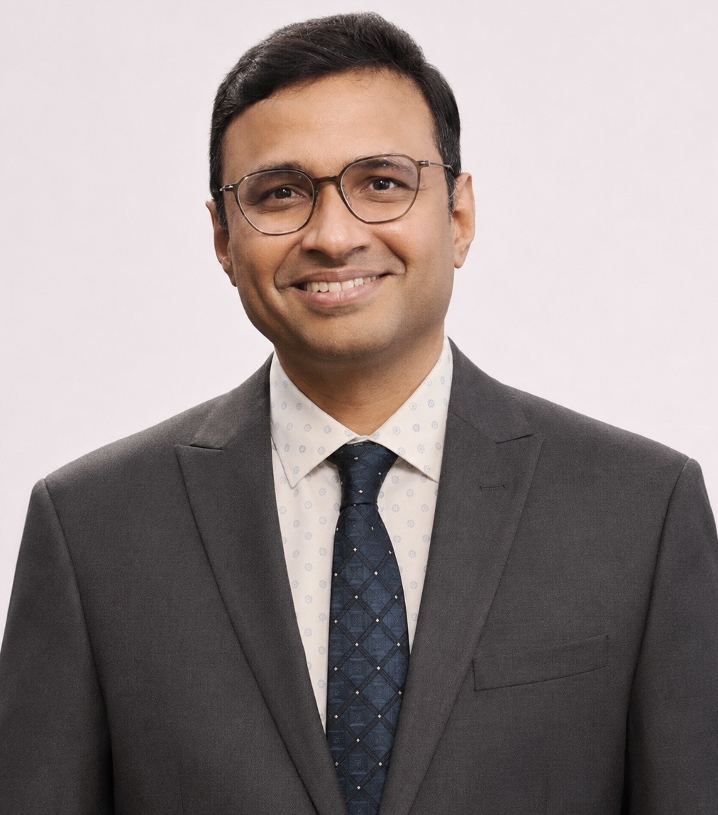 Dr. Sachin Arakere Nataraj in a dark suit